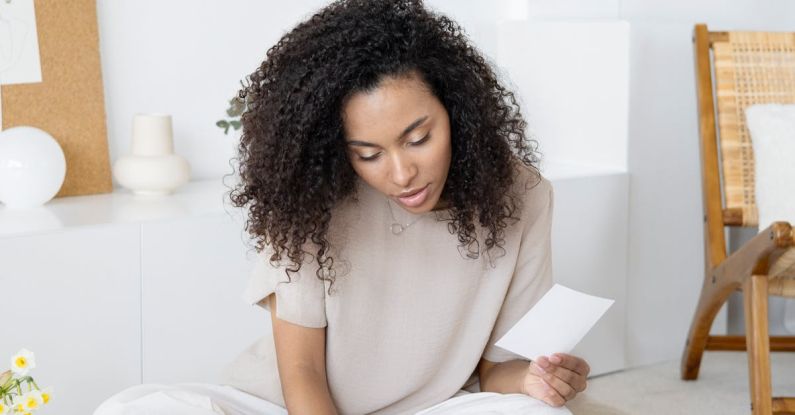 Marketing Colors - Woman Sitting on the Floor Looking at Swatches