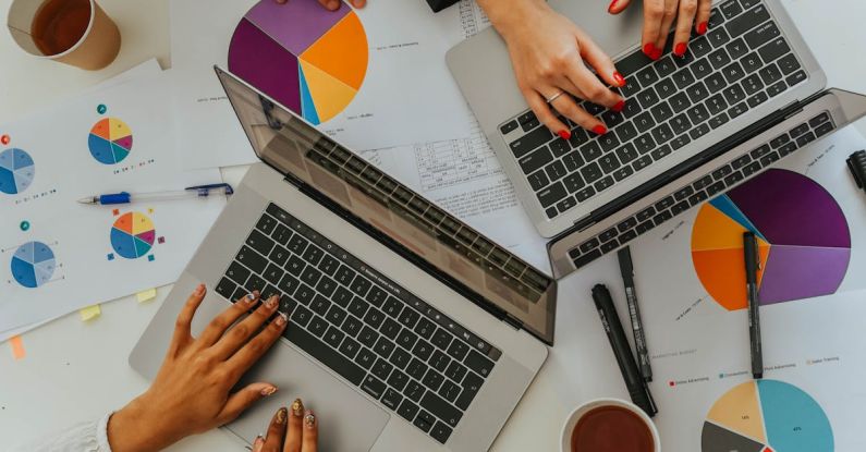 Chart Types - Persons Using Laptops on Table with Charts