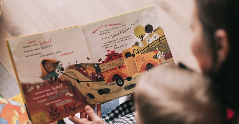 Storytelling Elements - Woman Reading Book to Toddler