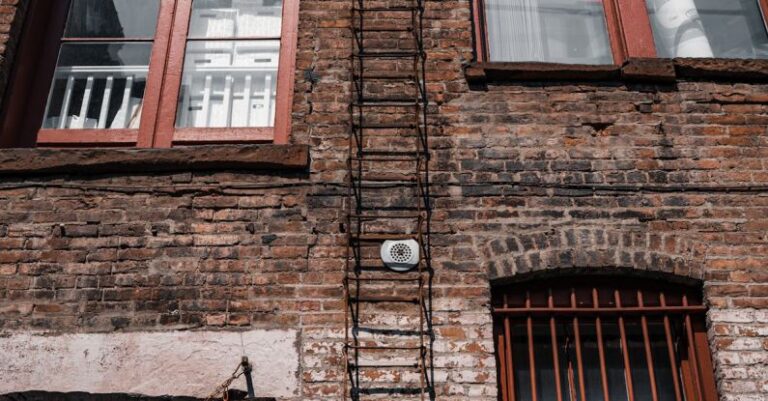 Visual Storytelling - A sculpture of a man climbing a building