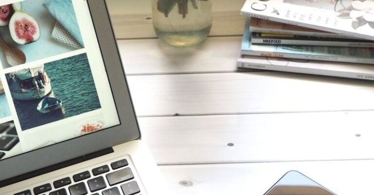 Real-Time Data - Macbook Air, Flower Bouquet and Magazines on White Table