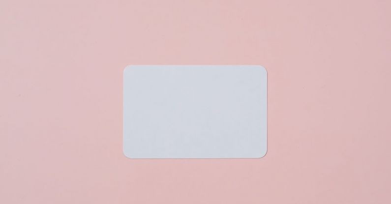 Brand Elements - White visiting card with empty space for data placed on light pink background