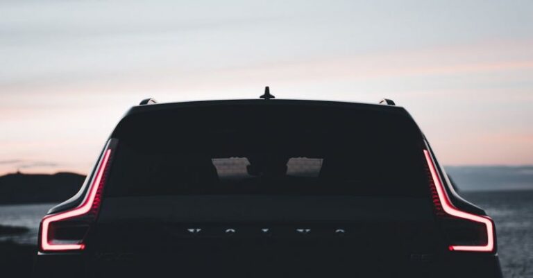 Brand Design - The rear end of a volvo car at sunset