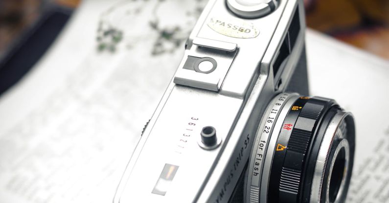 Photography Trends - Vintage camera on book on table