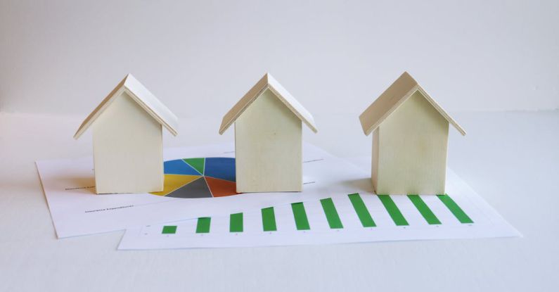 Infographic Layouts - Wooden Model Houses and Printed Graphs