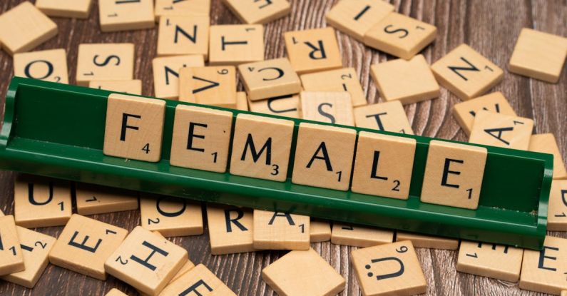 Visual Communication - The word female is spelled out with scrabble tiles