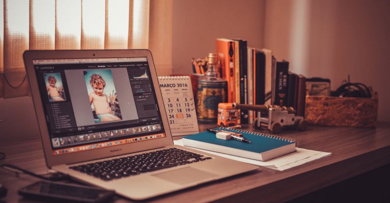 Video Editing - Turned on Screen Silver Macbook Air on Wooden Desk